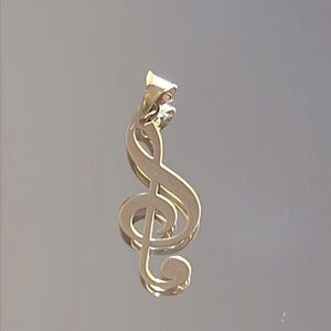 18k solid gold music note pendant. Gold tone